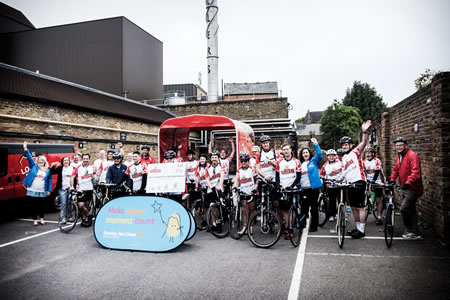 group shot of fullers employees before charity cycle