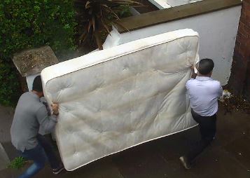 Men dumping mattress in Shepherd's Bush
