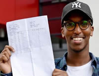 Phoenix High student Jibril Hassan with A Level Results